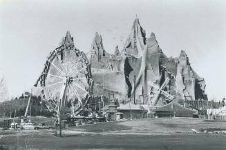 Workmen straddled the heavy steel framework grid (left) to apply galvanized metal lathe (above, right) before spraying the mountain with one coat of s(...)