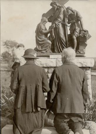 In (4) two worshippers, praying at the shrine