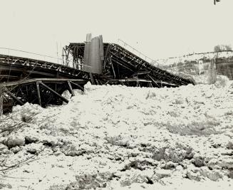 Workmen narrowly escaped these tons of steel, The pressure of ice heaved the bridge at its abutments on the United States side of the river