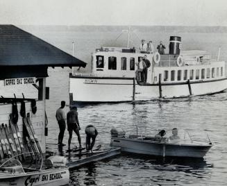 The Picturesque steamer arrives at Bigwin Island from the Mainland, Glistening lakes are not only fun to sail on, they're paradise for the sports-minded water skiers