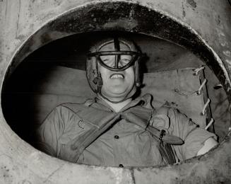 Ready to go with his crash helmet on his head and strapped to the hammock in his barrel is Red Hill in this last picture taken before he starts. All t(...)