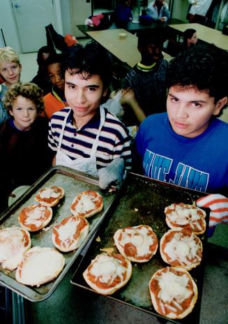 At park public school, top, Marlina Jack, left, and Shaunna Irish tuck into a hot lunch