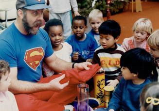 It's a bird . . . It's a plane . . . No, it's the teacher!, Sheppard Avenue Public School kindergarden teacher John Cavers does magic tricks for his students