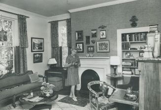 Mrs. Wilder breckenridge stands in front of the fireplace in Cantley House, built as a cottage in 1838 and enlarged to two storeys in the 1850s. It is(...)