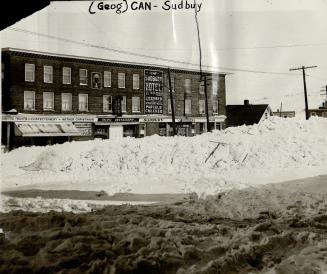 Sudbury snowbound - Snow drifts many feet dep tied up Sudbury during a recent storm