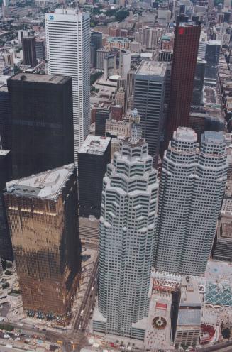 Brookfield's John Campbell, left, is charged with finding tenants to fill the Canada Trust Tower, directly above, and the Bay-Wellington Tower, right