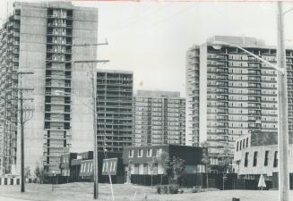 Four of six towers making up Deltan Bridlewood are shown in this telephoto picture which tends to make them appear bunched Actually five buildings are(...)