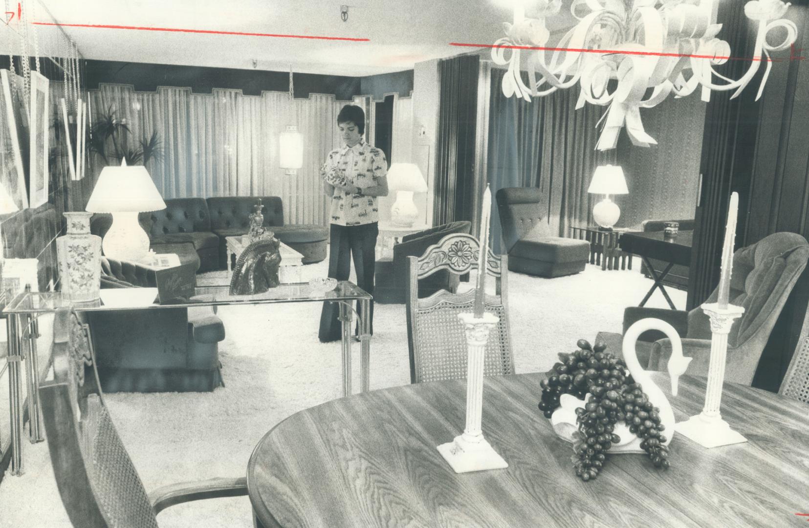 The 23-foot living room of the $46,900 condominium apartment in Deltan Bridlewood is shown here from the dinning room end. Off to the right the study (...)