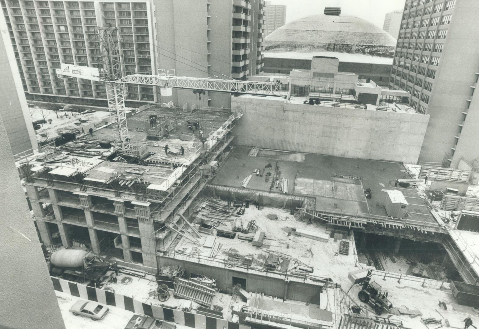 New housing with a gardens view, Yes, that's the roof of the Maple Leaf Gardens you see, framed between the double towers of the Carlton Inn, on Carlt(...)