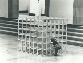 Erin Low, 2, seeks the inside story on Sol Lewitt's Open Modular Cup