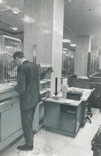 Chocolate Bars of gold (arrowed) in teller's cage at the Bank of Nova Scotia, King and Bay Sts