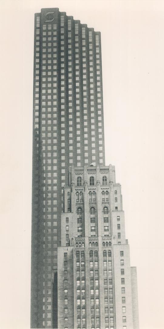 Tower Topping, A just-completed Scotia Plaza tower casts a tall shadow over the Canadian Imperial Bank of Commerce tower built in 1931. The Commerce b(...)