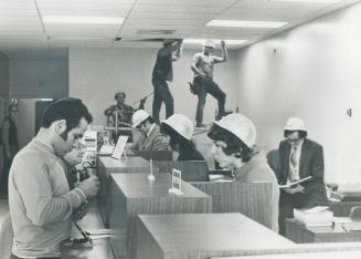 Staff at the newly-opened, almost-completed Roy Bank branch at Shoreham Shopping Centre on Jane