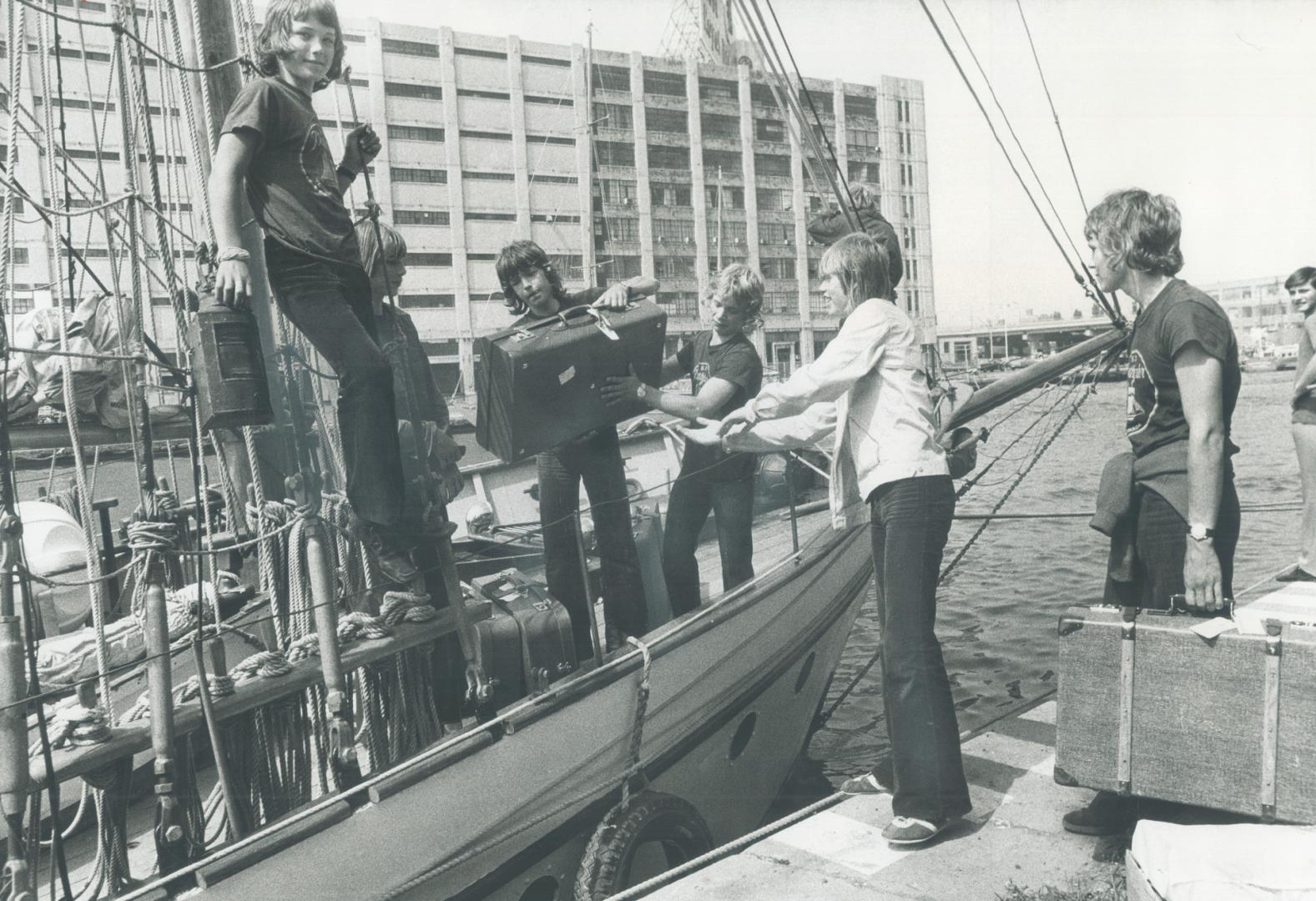 Fifteen-year-old boys from Oslo who are guests of the Big Brothers organization in Toronto come ashore from training brigantine Pathfinder, on which t(...)