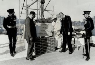 Moss Park Armory has its cornerstone laid by Defence Minister Paul Hellyer (right) as Mayor Philip Givens looks on