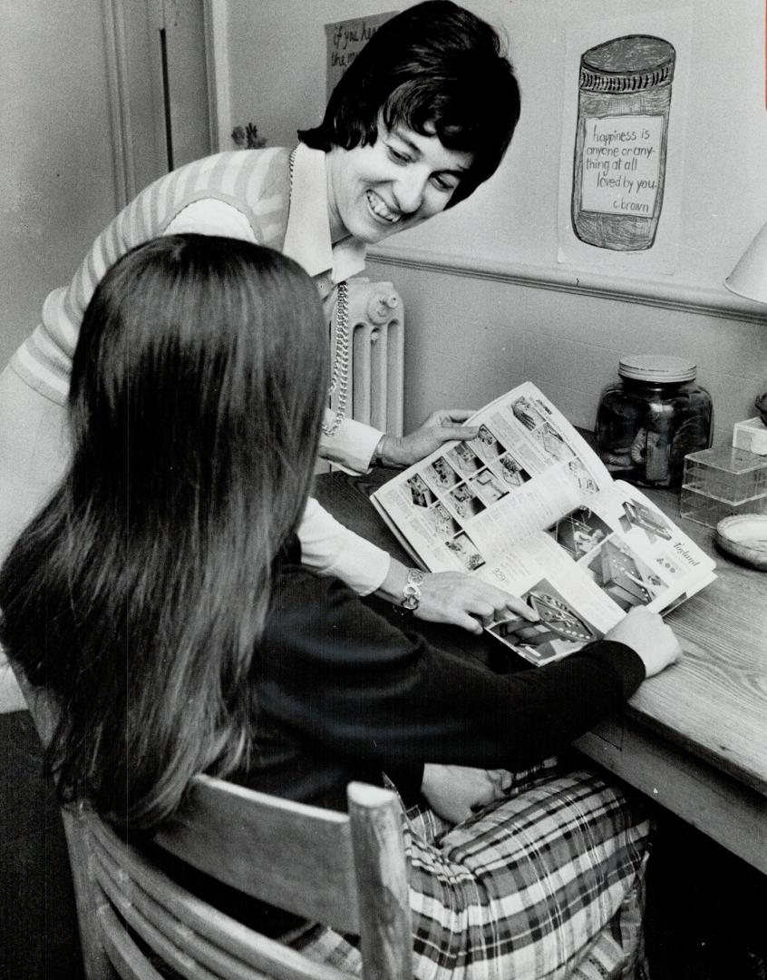 Big sister volunteer Bev Spragge at work, 'Now director pf public relations, Bev helps a young friend select Christmas gifts