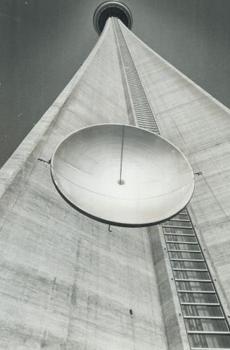 Micro-wave relfector pulled to top of CN tower