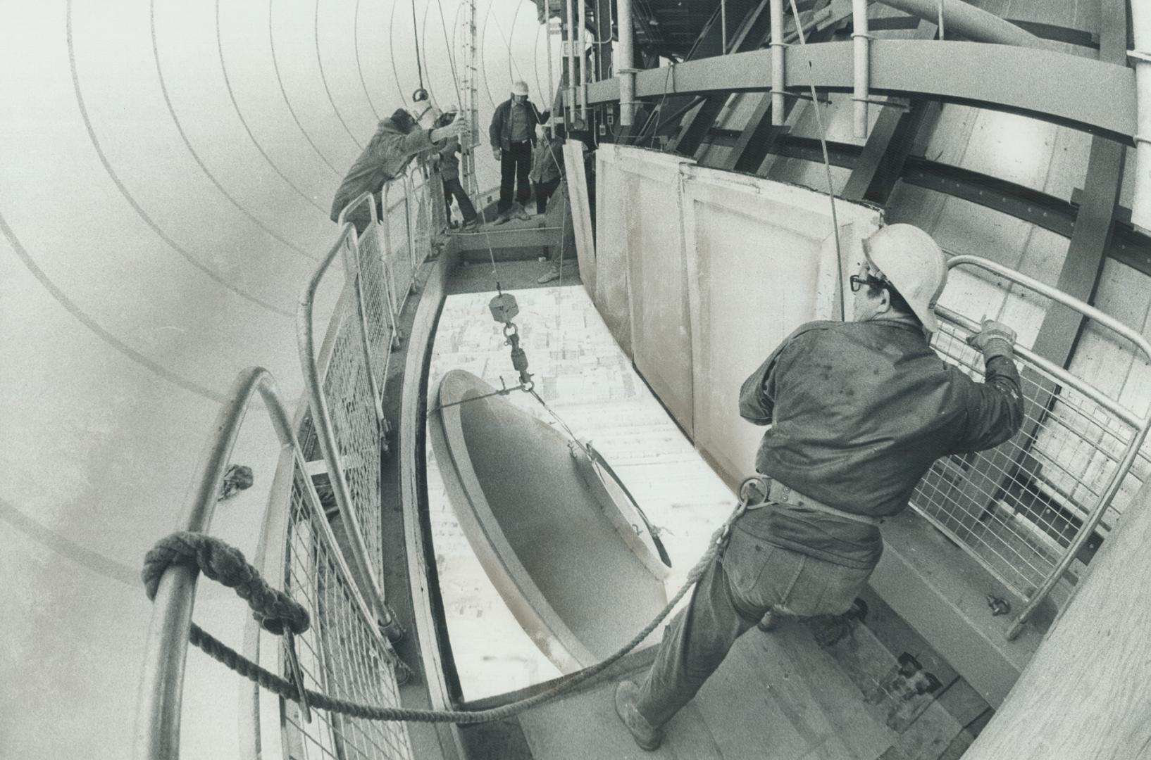 The last micro-wave reflector is put into place by CN Tower Crew