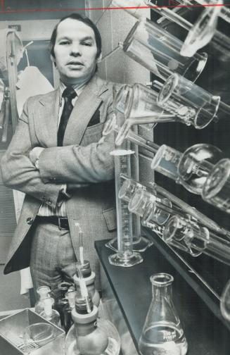 Alun Davies, Connaught executive vice-president, stands amid lab equipment in the firm's Steeles Ave