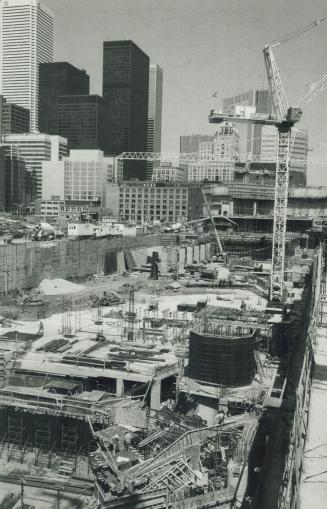 Doing the ground work. Construction crews are laying the foundation for Toronto's new $77-million convention centre, just east of the CN Tower on Fron(...)