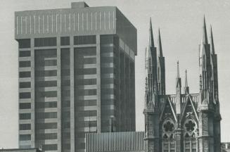 Dramatic contrast seen everywhere on Toronto's skyline is evidenced in this view of the Simpson Tower (left) at Queen and Bay Sts. and the spires of M(...)