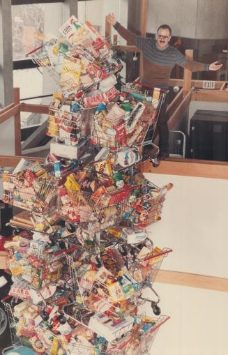 Of consuming interest: Above, communications officer Brian Stein stands beside an Ontario Science Centre display showing dramatically how much food a single Canadian eats every year