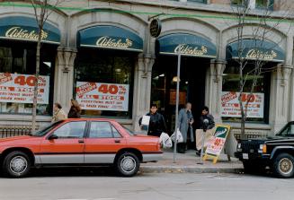 Going, going . . . The sale signs spark brisk business at Aikenhead's Front St. E. hardware store as teh company prepares to close its last two outlets