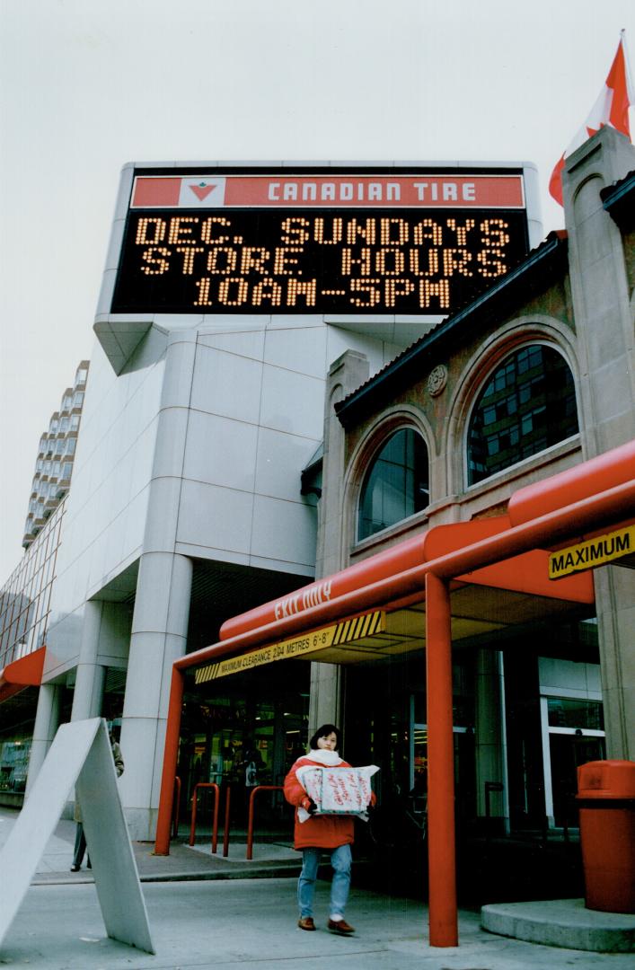 'Tis the season: Canadian Tire takes advantage of changes to the shopping law by putting up notice yesterday it will open Sunday in December