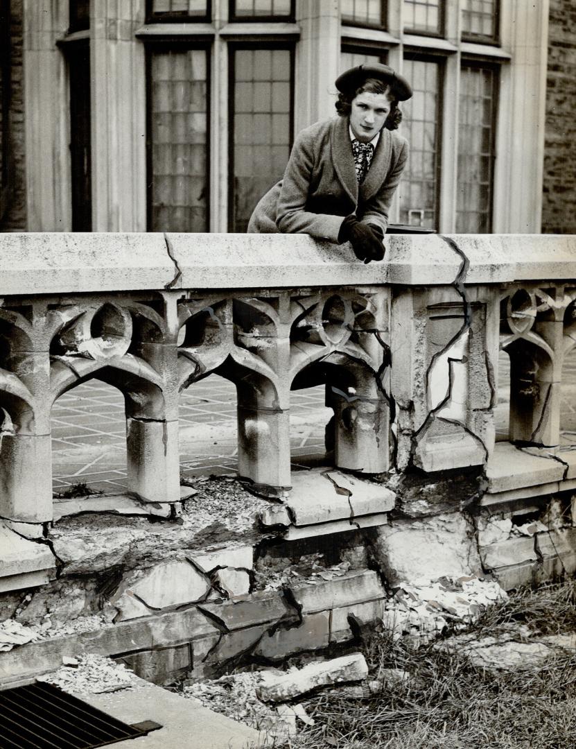 A visitor to Casa Loma surveys a Casa Loma balustrade, crumbling after years of inattention