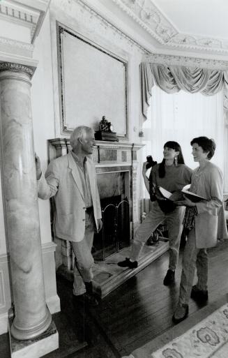 Classroom in a castle: Artists Andrejs Ritins and Lori LeMare-Ritins, at right, who offered their makeover services to Casa Loma free of charges review work on pillar with Wolff Knipping, centre