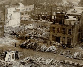 T. Eaton Co. Ltd. let contr act. photograph of the present wrecking operations, now in the block bounded by chanan, Bay and Haytar an and Sons are car(...)