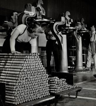 This is Freda Woodman with Bren gun barrels she has been inspecting