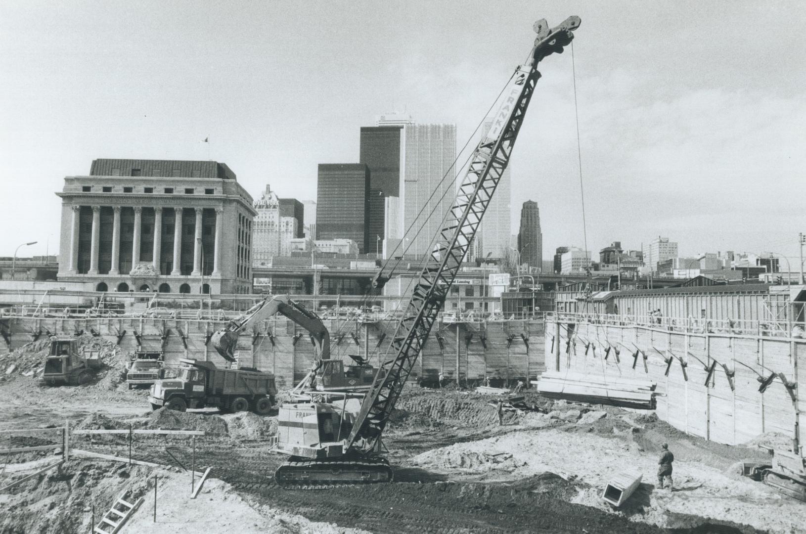 Fixing a hole where the rain gets in, Just south of the World Trade Centre, shown at left, workers are digging the foundation for the first of two towers of Water Park Place