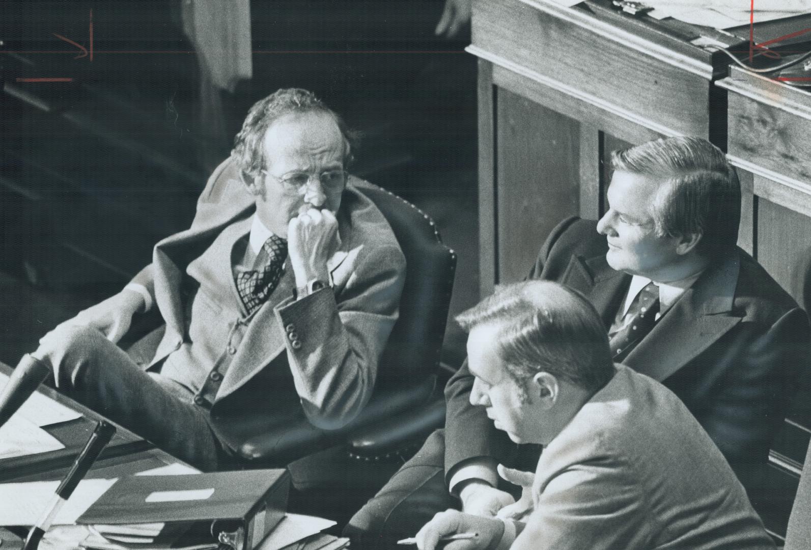 MPPs have heavy workload during winter break, says Robert Welch, above left, with Premier Davis in Legislature