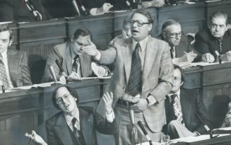 A scene from a comic opera may be what it looks like - but it's Liberal Leader Stuart Smith (seated) and former leader Robert Nixon engaged in a heate(...)