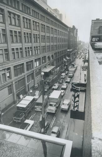 Trucks Unloading for Simpson's store on busy Metro-owned Richmond St