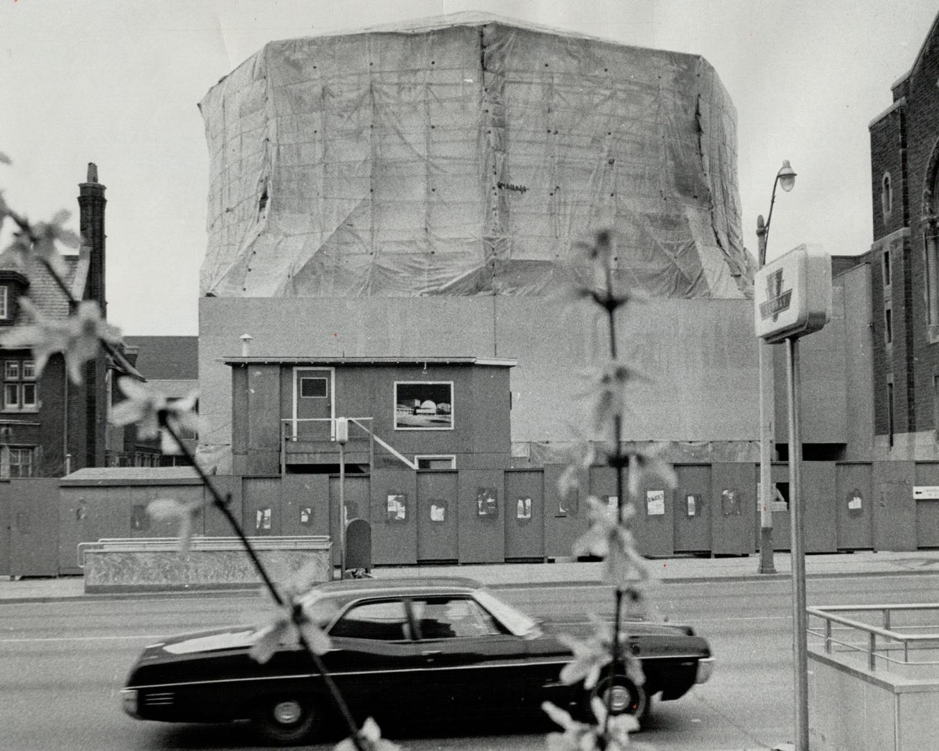 April 8, A plastic cocoon of more than 26,000 square of polythene sheeting towers 100 feet in the air, protecting the dome of the almost-completed McLaughlin Planetarium