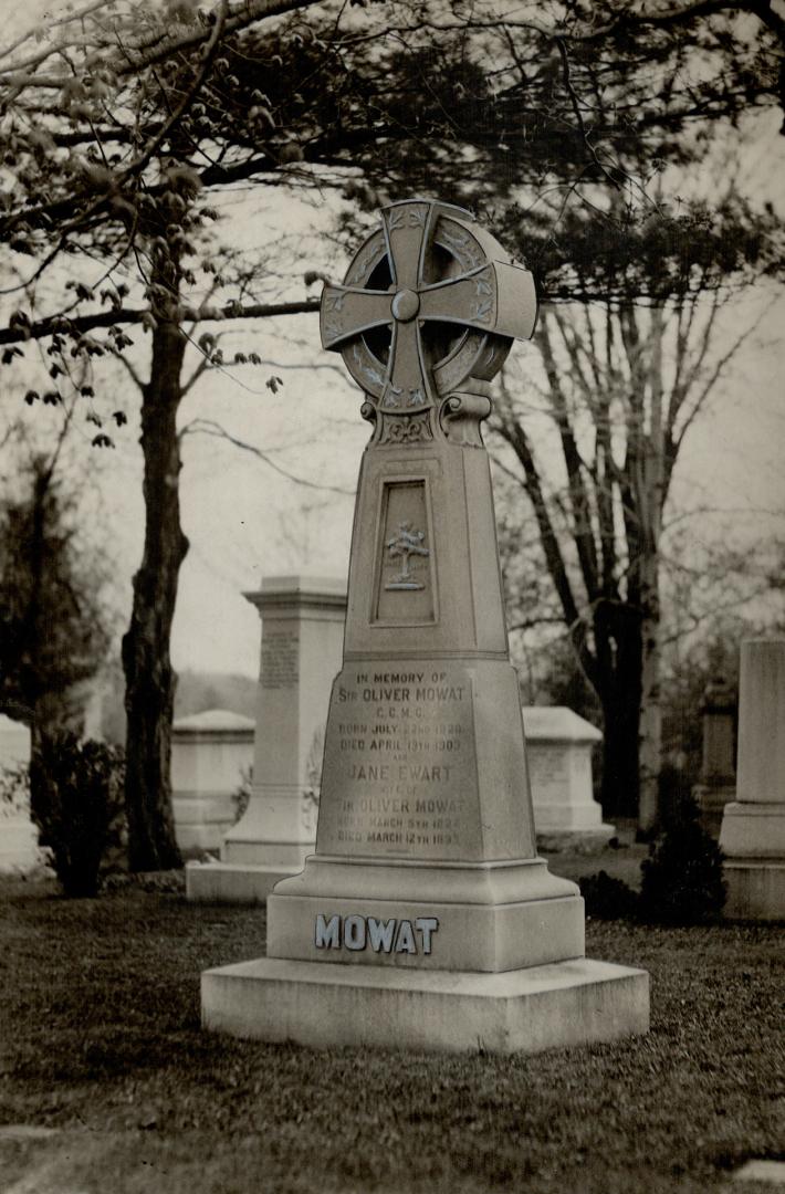 Image shows a gravestone in the cemetery.