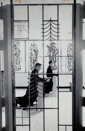 Priests praying, In Thanksgiving Chapel