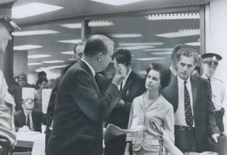 Mpp James Renwick confronting controller June Marks, Two burly plainclothesmen threw him out of City Hall meeting