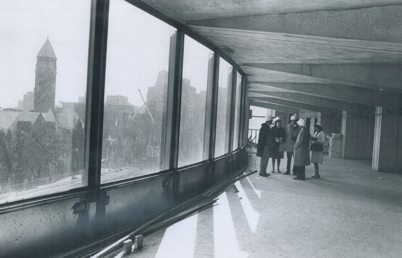 On 12th Floor of the West Tower the inspection party pauses to hear Revell talk about his design-the largest building he has been responsible for. Adm(...)