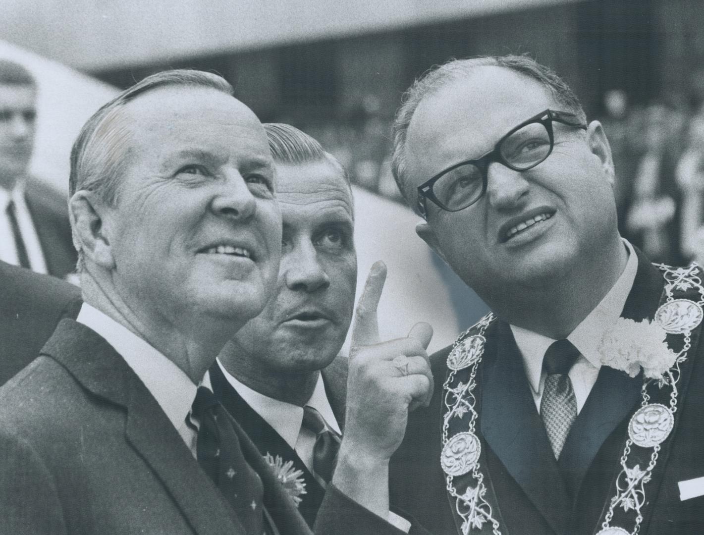 Prime Minister Pearson, Metro chairman Allen, Mayor givens at city hall, Pageantry marked day as city opened what PM called the most spectacular building I have ever seen