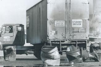 Backing a big truck into a narrow aisle, John Fougere, who's enrolled in the driver-training course takes four weeks and involves much practical Techn(...)