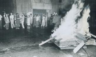 A splintered desk is burned outside Rochdale College last night, when three incidents occurred in three hours at the Bloor St. co-operative college re(...)