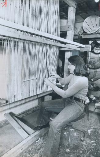 Tap of loom, operated by weaves Janet Hunter, is one of the low-key sounds now heard in the building which used to be a drapery factory. Janet plans t(...)