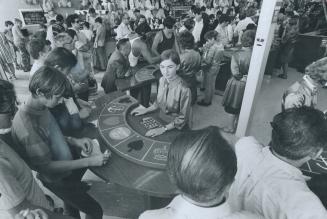 Crown and Anchor games along the midway drew good crowds yesterday on the CNE' s opening day