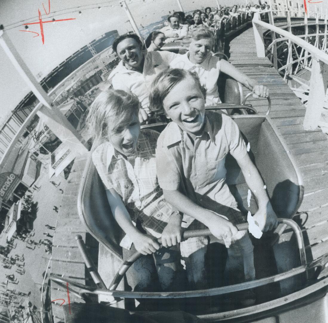 Taking a flyer at the CNE: Bart and Mary Tompsett atop the roller coaster ride yesterday with son Mudge and niece Debbie McCracken, both 11