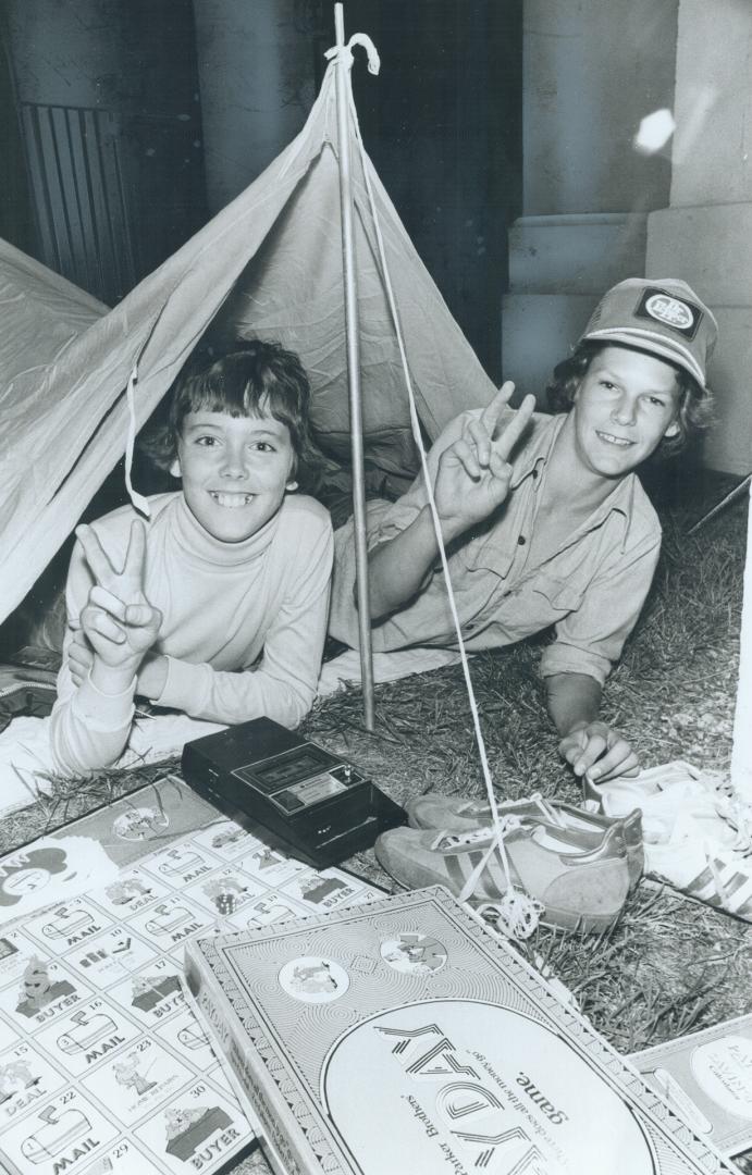 Determined to be first into this year's 100th anniversary Canadian National Exhibition, cousins Robert Robertson (left), 14, of North York, and Darryl(...)