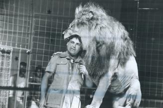 Dinner is served: Trusting tamer Frank Mogyorosi sticks his head into Leo The Lion's mouth during his act at the super little circus at the CNE's World of the Child section of the midway