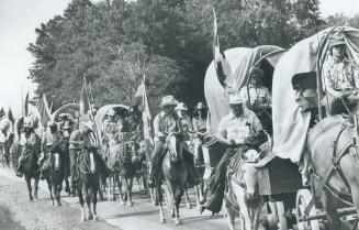 Pioneer Wagon train rolls along Derry Rd